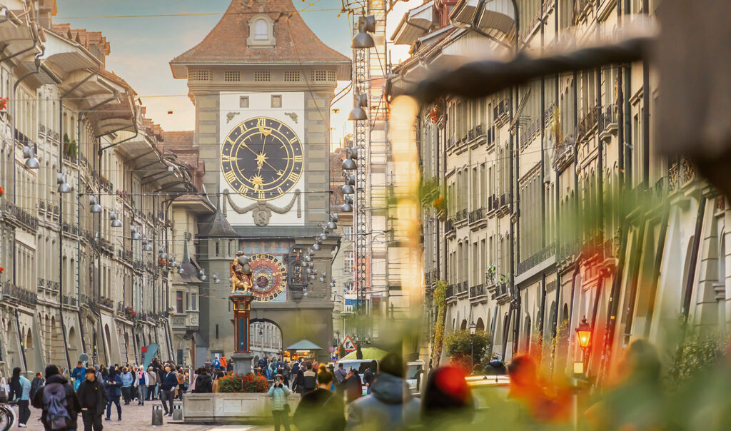 Bern clock tower along a historic city street