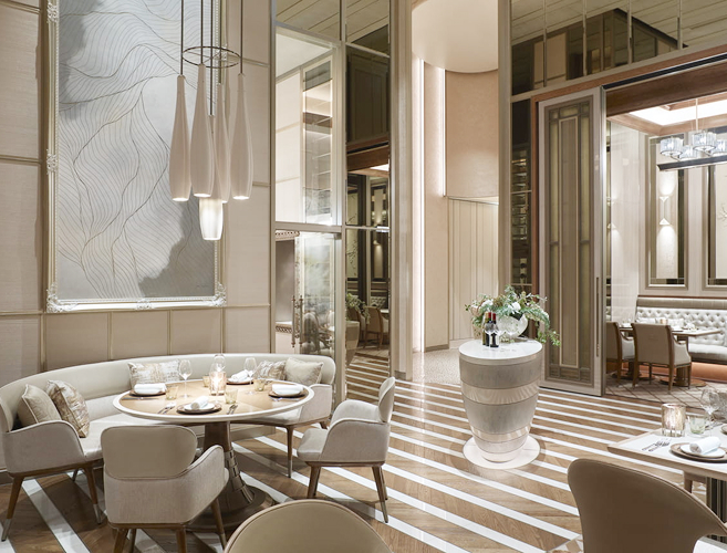 Elegant hotel dining room with floor-to-ceiling windows and contemporary décor