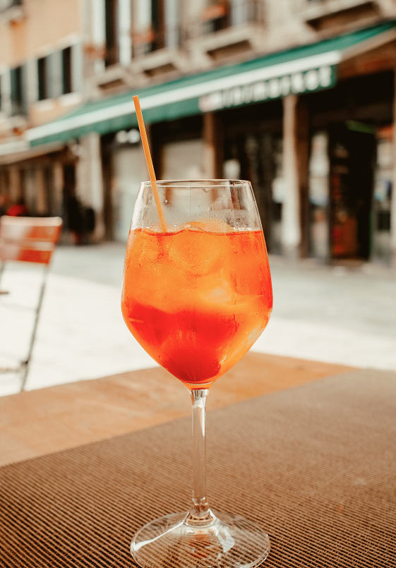 Orange spritz cocktail at an outdoor café